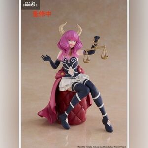 Pink and Blue Horned Figurine with Scales